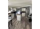 Open kitchen with island, white cabinets and stainless steel appliances at 50989 Highway 27 # 230, Davenport, FL 33897