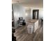 Island kitchen with light-colored cabinetry and vinyl flooring at 50989 Highway 27 # 230, Davenport, FL 33897