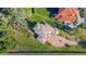 Aerial view of a house with unique roofline and driveway at 775 Christina Lake Dr, Lakeland, FL 33813