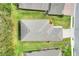 Aerial view of house showing roofline and landscaping at 7779 Lake James Blvd, Lakeland, FL 33810