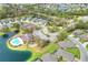 Aerial view of community with lake, pool, and homes at 7779 Lake James Blvd, Lakeland, FL 33810