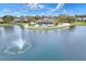 Community clubhouse with pool and fountain near a lake at 7779 Lake James Blvd, Lakeland, FL 33810