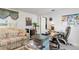 Bright home office with desk, comfortable seating, and built-in shelving at 352 Meandering Way, Polk City, FL 33868
