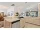 Kitchen with stainless steel dishwasher and view into the dining room at 352 Meandering Way, Polk City, FL 33868