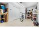 Organized garage workshop area with shelving and tools at 352 Meandering Way, Polk City, FL 33868