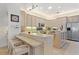 Open kitchen with breakfast bar and ample counter space at 352 Meandering Way, Polk City, FL 33868