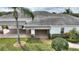 Rear view of house showing covered patio area at 352 Meandering Way, Polk City, FL 33868