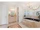 Spa-like Primary bathroom with soaking tub and separate vanity at 352 Meandering Way, Polk City, FL 33868