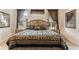 Elegant Primary bedroom with a king-size bed and stylish furnishings at 352 Meandering Way, Polk City, FL 33868