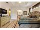 Spacious Primary bedroom with large bed, ensuite bathroom access, and TV at 352 Meandering Way, Polk City, FL 33868