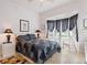 Bedroom with bay window and sitting area at 352 Meandering Way, Polk City, FL 33868