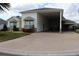 One story home with covered carport and landscaping at 352 Meandering Way, Polk City, FL 33868