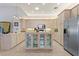 Bright kitchen with ample cabinetry, stainless steel appliances, and an island at 352 Meandering Way, Polk City, FL 33868