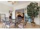 Sunroom features glass doors opening to the backyard and seating area at 352 Meandering Way, Polk City, FL 33868