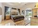 Spacious main bedroom with ample natural light and access to a private patio at 352 Meandering Way, Polk City, FL 33868