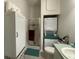 Bathroom features a shower, toilet, sink, and stackable washer/dryer at 336 Motorcoach S Dr, Polk City, FL 33868
