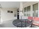 Small side patio with table and chairs adjacent to the house at 336 Motorcoach S Dr, Polk City, FL 33868