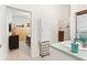 Bright bathroom with a walk-in shower, vanity, and laundry hookups at 336 Motorcoach S Dr, Polk City, FL 33868