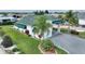 Property boasts a large garage with covered parking and a well-manicured lawn at 336 Motorcoach S Dr, Polk City, FL 33868