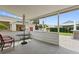 Covered patio with table and chairs, offering a shaded outdoor space at 336 Motorcoach S Dr, Polk City, FL 33868