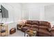 Relaxing living room with leather reclining sofa and large TV at 336 Motorcoach S Dr, Polk City, FL 33868
