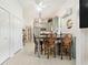 Modern kitchen with light cabinets, breakfast bar, and stainless steel appliances at 336 Motorcoach S Dr, Polk City, FL 33868