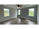 Bright bedroom with wood-look floors and large windows offering natural light at 532 Adams View Ln, Auburndale, FL 33823