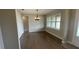 Spacious dining area with hardwood floors and a large window at 532 Adams View Ln, Auburndale, FL 33823