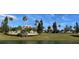 Community clubhouse with lush landscaping at 532 Adams View Ln, Auburndale, FL 33823
