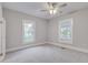 Spacious bedroom with neutral walls, ceiling fan, and ample natural light at 653 Avenue A Sw, Winter Haven, FL 33880