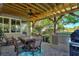 Outdoor patio with pergola, seating area, and built-in kitchen at 360 Motorcoach S Dr, Polk City, FL 33868