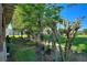 Landscaped backyard with lush greenery, trees, and garden at 360 Motorcoach S Dr, Polk City, FL 33868