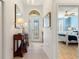 Bright entryway with tile flooring, console table, and view of bedroom at 360 Motorcoach S Dr, Polk City, FL 33868