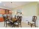Formal dining room with a large table, chandelier, and decorative fireplace at 360 Motorcoach S Dr, Polk City, FL 33868