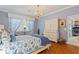 Elegant bedroom with a queen bed, hardwood floors, and built-in storage at 360 Motorcoach S Dr, Polk City, FL 33868