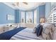 Bright bedroom with a comfortable bed, window seat, and built-in desk at 360 Motorcoach S Dr, Polk City, FL 33868