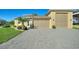 House exterior with a large driveway and attached garage at 360 Motorcoach S Dr, Polk City, FL 33868
