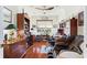 Spacious home office with built-in shelving and hardwood floors at 360 Motorcoach S Dr, Polk City, FL 33868