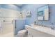 Clean bathroom with a walk-in shower, marble vanity, and modern fixtures at 360 Motorcoach S Dr, Polk City, FL 33868