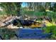 Relaxing backyard pond with waterfall feature and a comfortable bench at 360 Motorcoach S Dr, Polk City, FL 33868