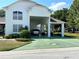 Two-car garage with covered carport at 1214 Motorcoach Dr, Polk City, FL 33868