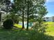 Landscaped backyard with pond and fountain at 1214 Motorcoach Dr, Polk City, FL 33868