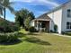 Brick and shingle exterior with front porch at 1214 Motorcoach Dr, Polk City, FL 33868