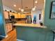 Kitchen with granite countertops, stainless steel appliances, and breakfast bar at 1214 Motorcoach Dr, Polk City, FL 33868