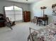 Bright bedroom with carpeted floors and large window at 1214 Motorcoach Dr, Polk City, FL 33868
