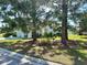 Backyard view of house with mature trees at 1214 Motorcoach Dr, Polk City, FL 33868