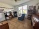 Home office with built-in desk and ample natural light at 1214 Motorcoach Dr, Polk City, FL 33868
