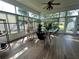 Relaxing sunroom with ample natural light and tiled floors at 1214 Motorcoach Dr, Polk City, FL 33868