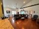 Open living area with hardwood floors and a view to the kitchen at 1214 Motorcoach Dr, Polk City, FL 33868