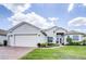 House exterior with a two-car garage at 6265 Pinehurst Loop, Winter Haven, FL 33884